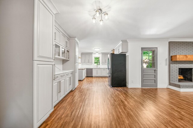116 Skyview Dr, Columbia, TN 38401 - kitchen with stainless steel appliances, light countertops, light wood finished floors, and white cabinets