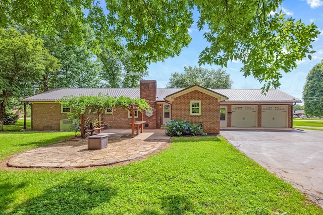 116 Skyview Dr, Columbia, TN 38401 - single story home with brick siding, a metal roof, a chimney, and a front yard