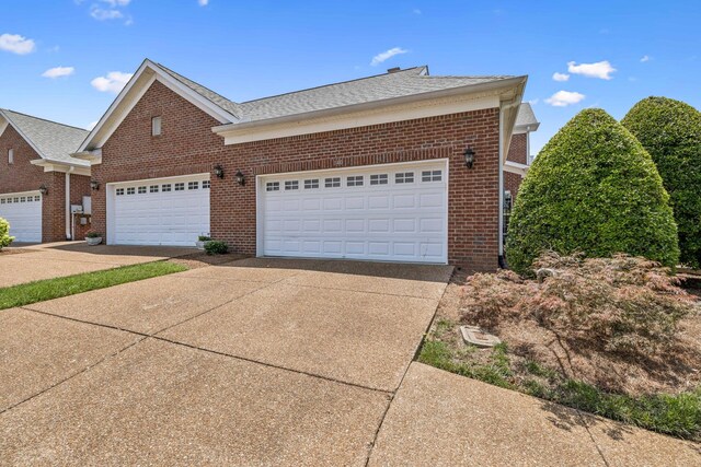 140 Ormesby Pl, Franklin, TN 37064 - view of front of property with brick siding, driveway, and a shingled roof