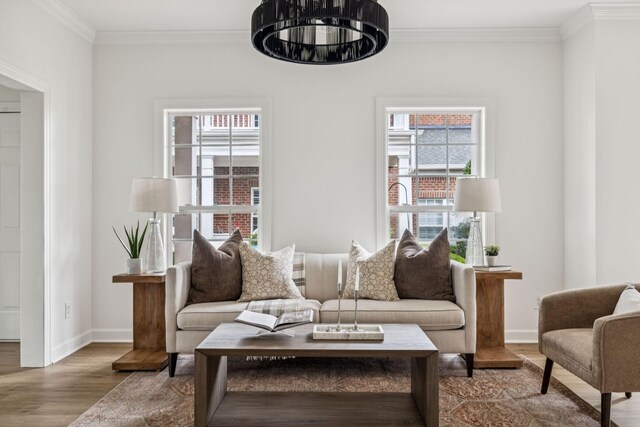 140 Ormesby Pl, Franklin, TN 37064 - living room featuring wood finished floors, crown molding, and a chandelier
