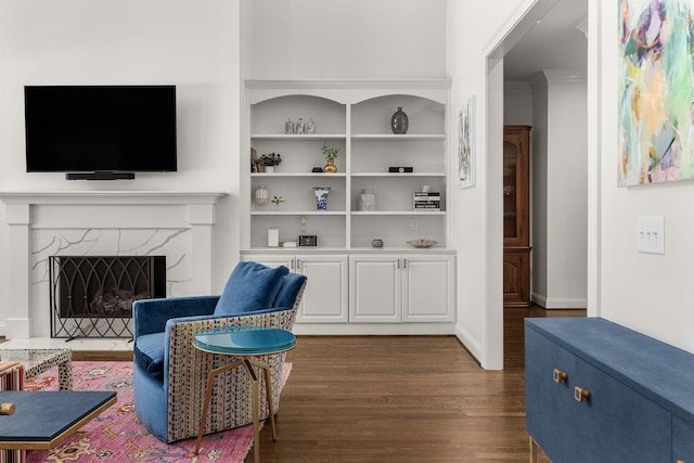 5605 Ottershaw Ct, Brentwood, TN 37027 - living area with dark wood-type flooring, built in features, and a fireplace