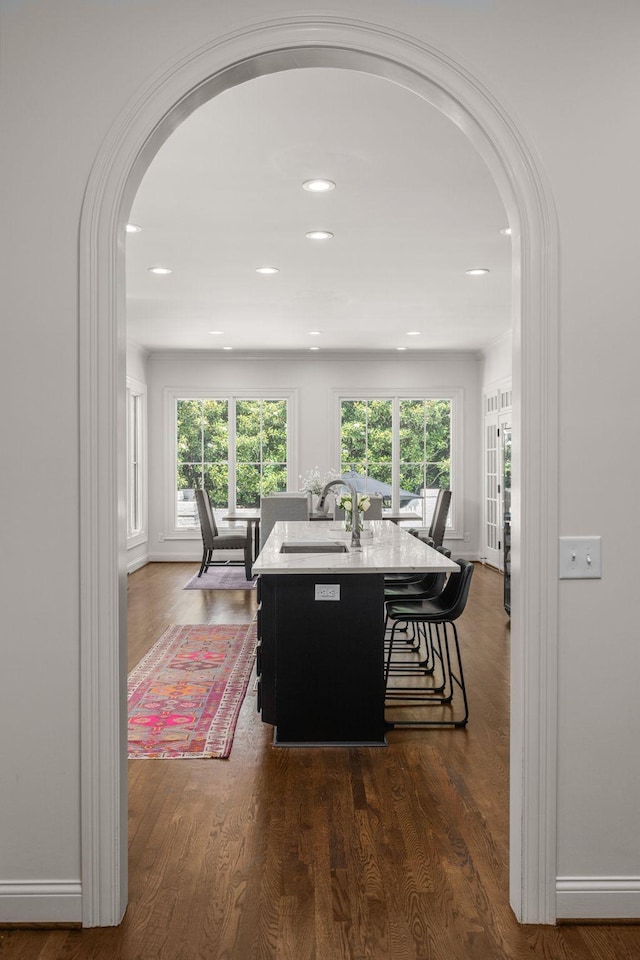 5605 Ottershaw Ct, Brentwood, TN 37027 - dining space with arched walkways, healthy amount of natural light, dark wood-style floors, and recessed lighting