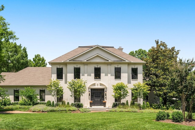 5605 Ottershaw Ct, Brentwood, TN 37027 - view of front of home with a front yard, brick siding, and a chimney