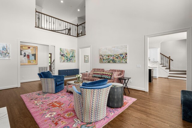 5605 Ottershaw Ct, Brentwood, TN 37027 - living area with stairway, wood finished floors, a towering ceiling, and recessed lighting