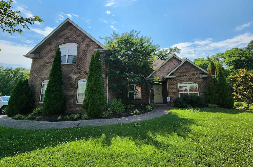 176 Sparrow Gap Dr, La Vergne, TN 37086 - view of front of property featuring brick siding and a front yard