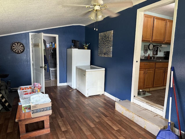 78 Mcdonough Rd, Dunlap, TN 37327 - kitchen with brown cabinets, ceiling fan, dark wood finished floors, freestanding refrigerator, and vaulted ceiling