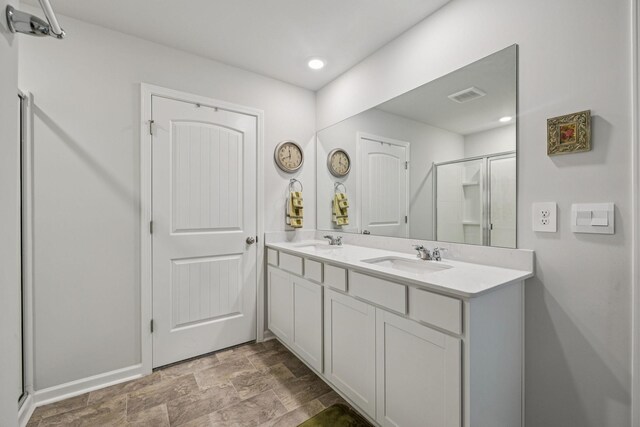 2410 Tate Farm Ln, White House, TN 37188 - full bath featuring double vanity, a stall shower, recessed lighting, and stone finish flooring