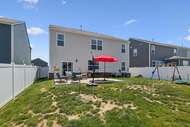 2410 Tate Farm Ln, White House, TN 37188 - rear view of house with a patio and a fenced backyard
