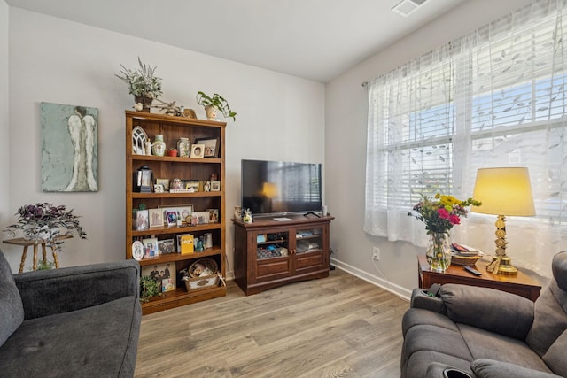 2410 Tate Farm Ln, White House, TN 37188 - living room featuring light wood-type flooring and baseboards