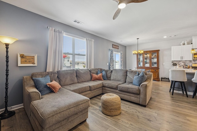 2410 Tate Farm Ln, White House, TN 37188 - living room featuring a chandelier, light wood-type flooring, and ceiling fan