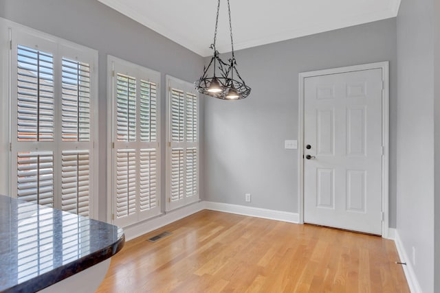 2910 Chaucer Dr, Murfreesboro, TN 37129 - unfurnished dining area featuring wood finished floors and crown molding