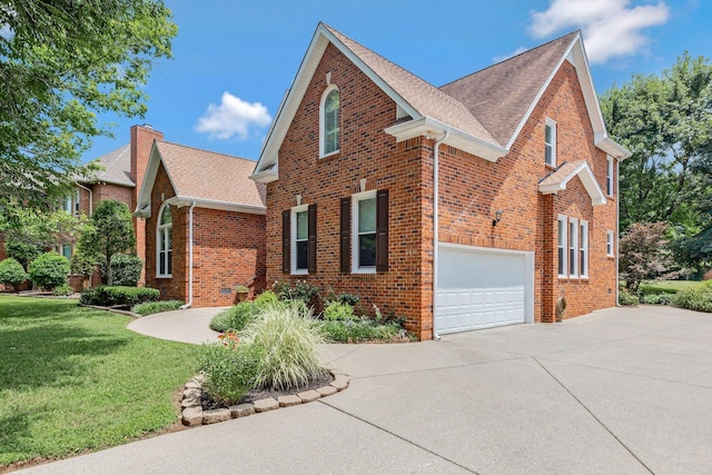 2910 Chaucer Dr, Murfreesboro, TN 37129 - view of front of home featuring brick siding, driveway, a front lawn, an attached garage, and roof with shingles