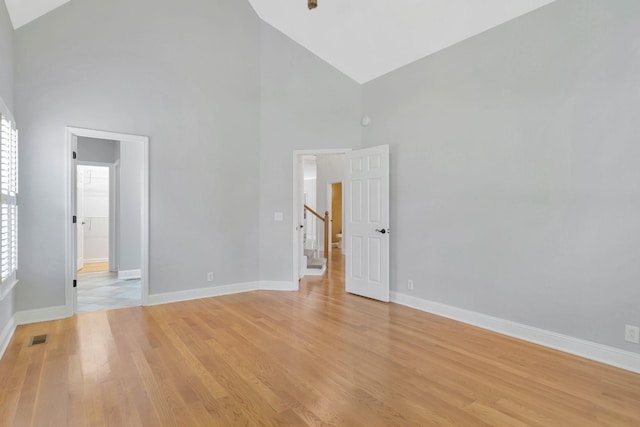 2910 Chaucer Dr, Murfreesboro, TN 37129 - empty room featuring high vaulted ceiling, light wood finished floors, plenty of natural light, and stairway