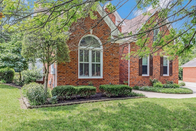 2910 Chaucer Dr, Murfreesboro, TN 37129 - view of home's exterior with brick siding and a yard