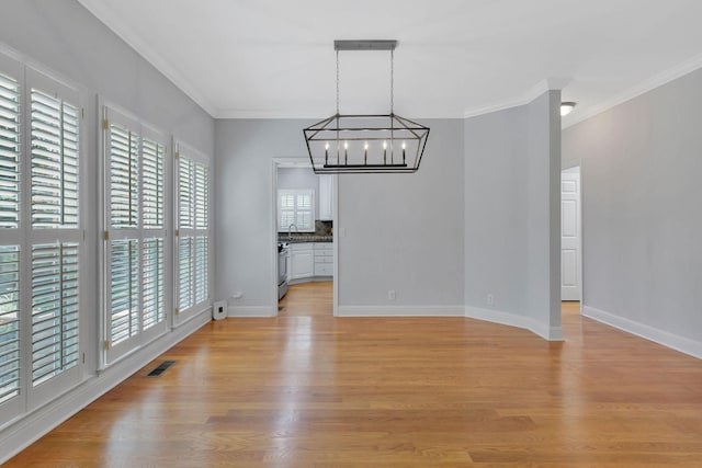 2910 Chaucer Dr, Murfreesboro, TN 37129 - unfurnished dining area featuring a chandelier, ornamental molding, and light wood finished floors