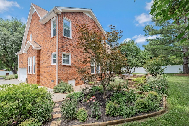 2910 Chaucer Dr, Murfreesboro, TN 37129 - view of side of property featuring brick siding, driveway, and an attached garage