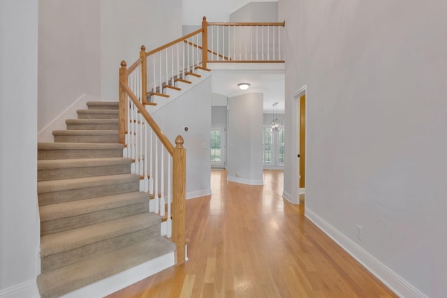 2910 Chaucer Dr, Murfreesboro, TN 37129 - stairway featuring wood finished floors and a towering ceiling