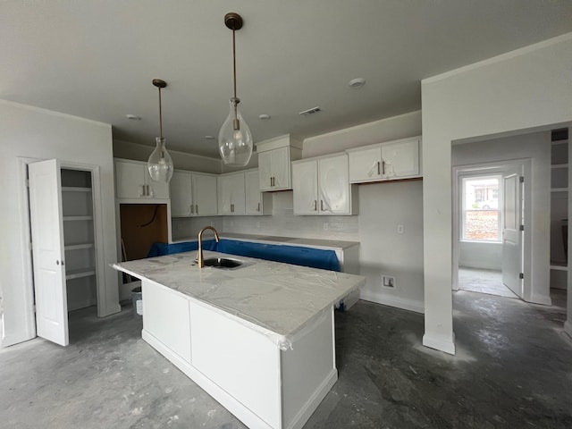 1830 Ableson Way, Columbia, TN 38401 - kitchen with unfinished concrete flooring, a kitchen island with sink, white cabinetry, and light stone counters