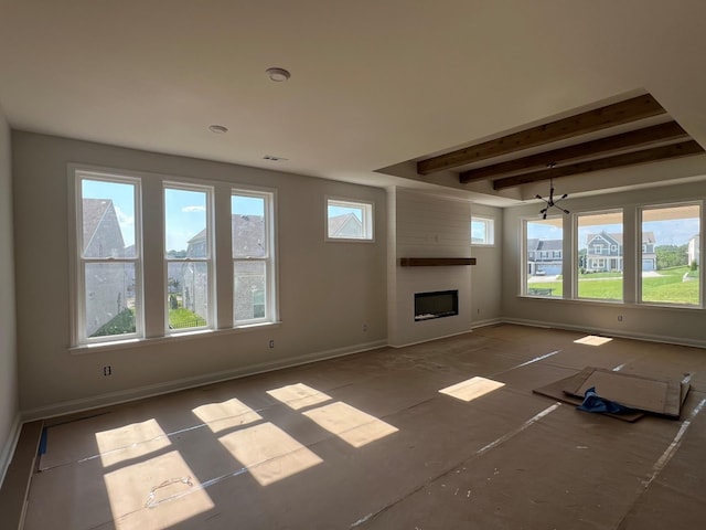 1830 Ableson Way, Columbia, TN 38401 - unfurnished living room featuring healthy amount of natural light, beamed ceiling, a fireplace, and a chandelier