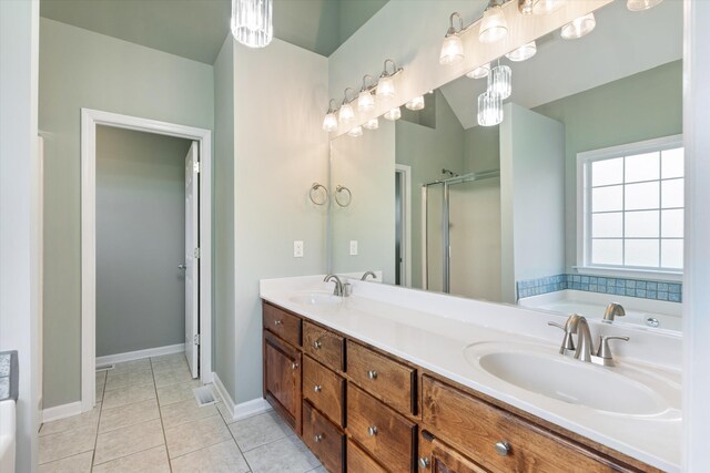 717 Pleasant View Dr, Columbia, TN 38401 - bathroom featuring a stall shower, double vanity, a bath, and tile patterned floors