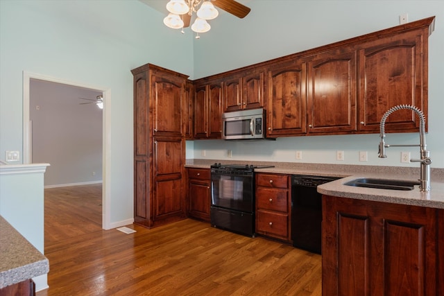717 Pleasant View Dr, Columbia, TN 38401 - kitchen featuring black appliances, a ceiling fan, and wood finished floors