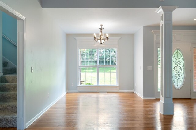 717 Pleasant View Dr, Columbia, TN 38401 - entryway featuring decorative columns, stairway, wood finished floors, and a chandelier