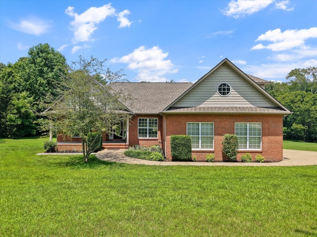 717 Pleasant View Dr, Columbia, TN 38401 - view of front of house featuring a front yard, brick siding, and a shingled roof