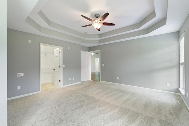 717 Pleasant View Dr, Columbia, TN 38401 - unfurnished bedroom with a raised ceiling, light carpet, a spacious closet, and ceiling fan