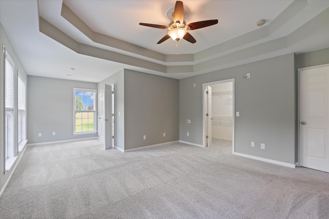 717 Pleasant View Dr, Columbia, TN 38401 - empty room with a ceiling fan, a tray ceiling, light carpet, and a smoke detector