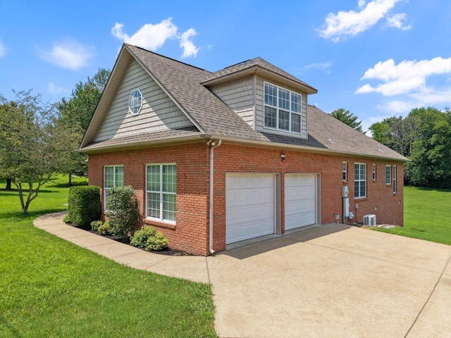 717 Pleasant View Dr, Columbia, TN 38401 - view of side of home with brick siding, a lawn, roof with shingles, driveway, and a garage