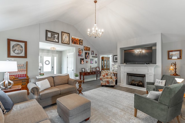 30 Hunting Ridge Cir, Rock Spring, GA 30739 - living area with vaulted ceiling, a chandelier, a fireplace, and wood finished floors