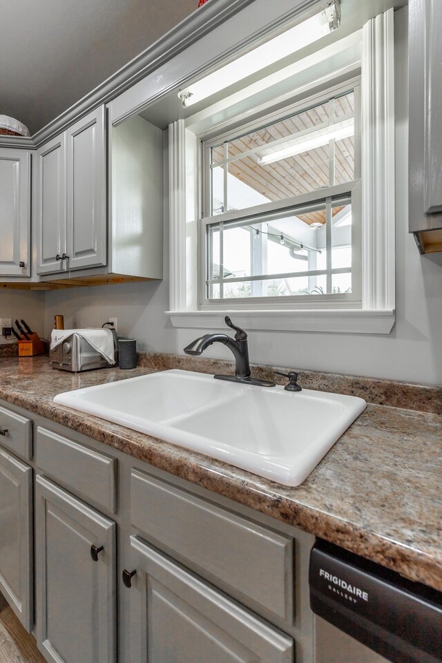 30 Hunting Ridge Cir, Rock Spring, GA 30739 - kitchen featuring dishwasher, healthy amount of natural light, and gray cabinets