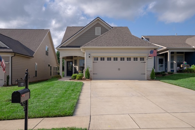1727 Humphreys Gln, Spring Hill, TN 37174 - craftsman house with an attached garage, a front lawn, concrete driveway, and a shingled roof