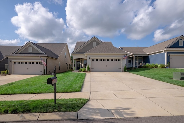 1727 Humphreys Gln, Spring Hill, TN 37174 - view of front facade featuring driveway, a front lawn, and an attached garage