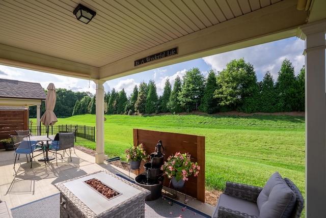 1727 Humphreys Gln, Spring Hill, TN 37174 - view of patio / terrace with an outdoor fire pit, outdoor dining space, and view of scattered trees