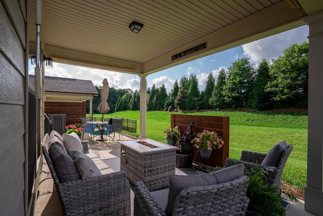 1727 Humphreys Gln, Spring Hill, TN 37174 - view of patio / terrace with an outdoor living space with a fire pit and view of wooded area
