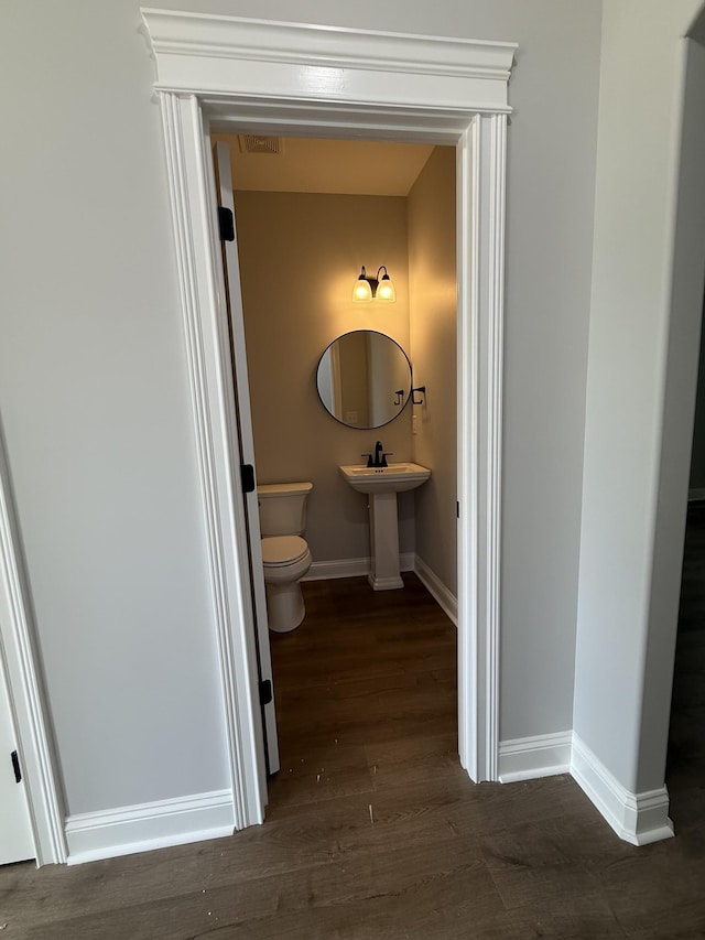 711 Johnson St, Clarksville, TN 37043 - bathroom featuring toilet and wood finished floors