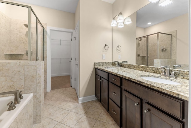 526 Sydenham Dr, Franklin, TN 37064 - bathroom with a stall shower, double vanity, tile patterned floors, a spacious closet, and a garden tub