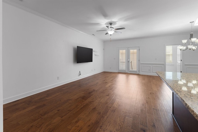 526 Sydenham Dr, Franklin, TN 37064 - unfurnished living room with a ceiling fan, a chandelier, plenty of natural light, crown molding, and dark wood-type flooring