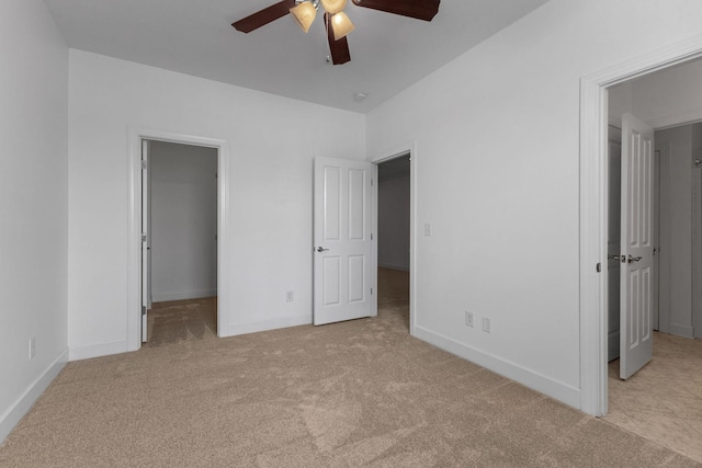 526 Sydenham Dr, Franklin, TN 37064 - unfurnished bedroom featuring a walk in closet, carpet floors, ceiling fan, and a closet