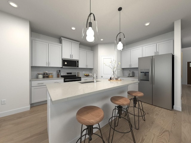 1509 Bear Branch Trce, Columbia, TN 38401 - kitchen featuring stainless steel appliances, light wood-style flooring, recessed lighting, decorative backsplash, and a kitchen breakfast bar