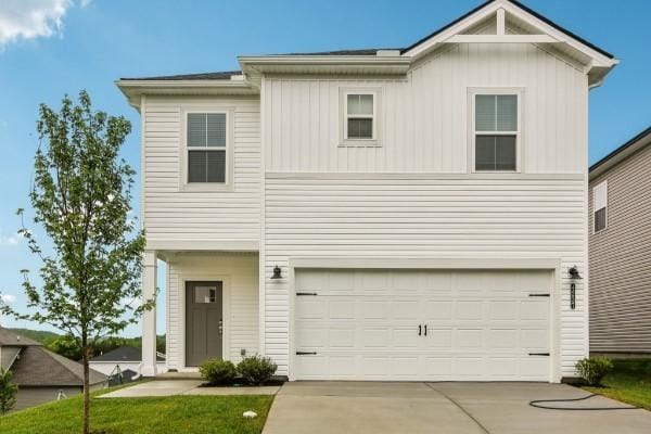 1509 Bear Branch Trce, Columbia, TN 38401 - view of front of home featuring concrete driveway, a garage, and board and batten siding