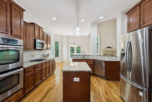 4019 Fremantle Cir, Spring Hill, TN 37174 - kitchen featuring stainless steel appliances, decorative backsplash, light wood-style floors, and recessed lighting