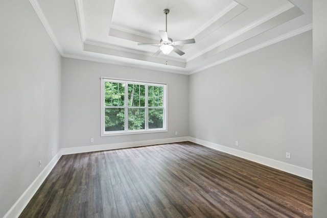 4019 Fremantle Cir, Spring Hill, TN 37174 - empty room featuring dark wood-type flooring, ceiling fan, a tray ceiling, and ornamental molding