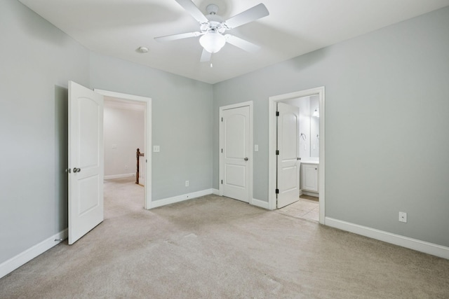 4019 Fremantle Cir, Spring Hill, TN 37174 - unfurnished bedroom featuring light colored carpet, connected bathroom, and a ceiling fan