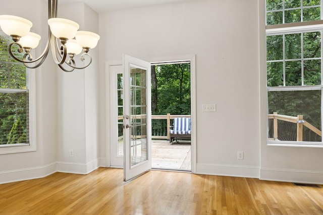 4019 Fremantle Cir, Spring Hill, TN 37174 - doorway featuring plenty of natural light, wood finished floors, and a chandelier