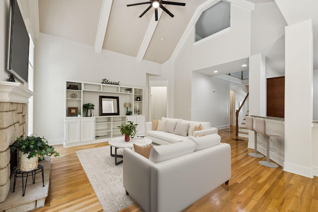 4019 Fremantle Cir, Spring Hill, TN 37174 - living area featuring high vaulted ceiling, stairway, a ceiling fan, beam ceiling, and light wood-type flooring