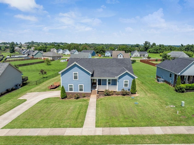 1021 Tulip Dr, Ashland City, TN 37015 - traditional-style home featuring a porch, a residential view, driveway, and roof with shingles