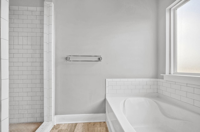 1021 Tulip Dr, Ashland City, TN 37015 - full bathroom with a bath, a stall shower, and wood finished floors