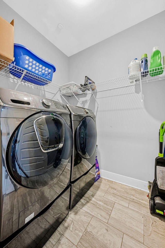 1021 Tulip Dr, Ashland City, TN 37015 - laundry room featuring washer and dryer and baseboards